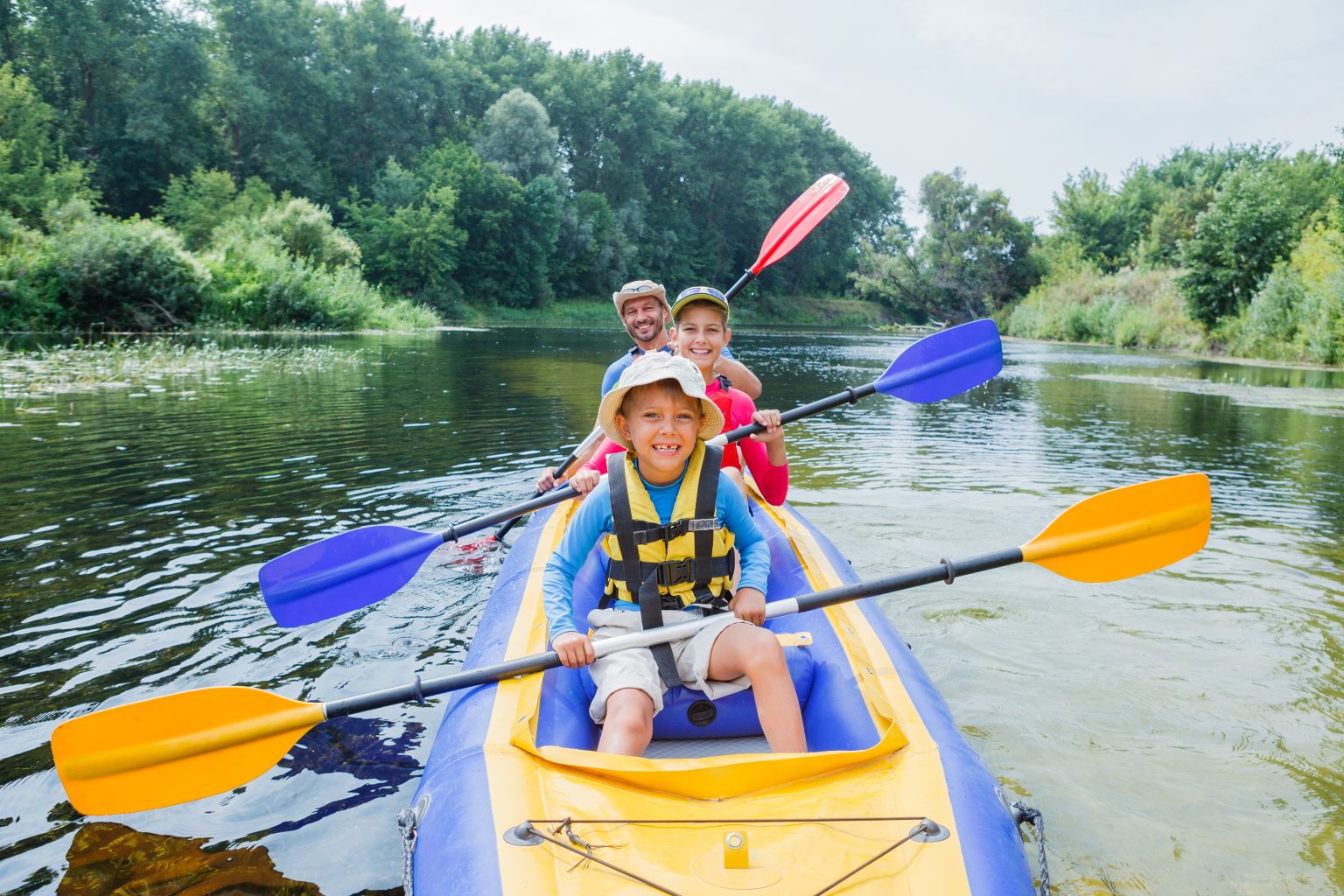 Family kayaking on the river